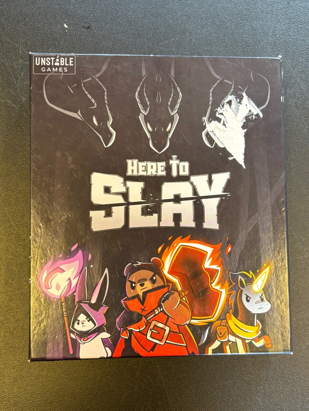 Here to Slay Board Game - Dark Purple Cover with Colorful Characters